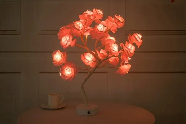 White and red rose flower LED lamp on a bonsai tree stand with warm white lights.