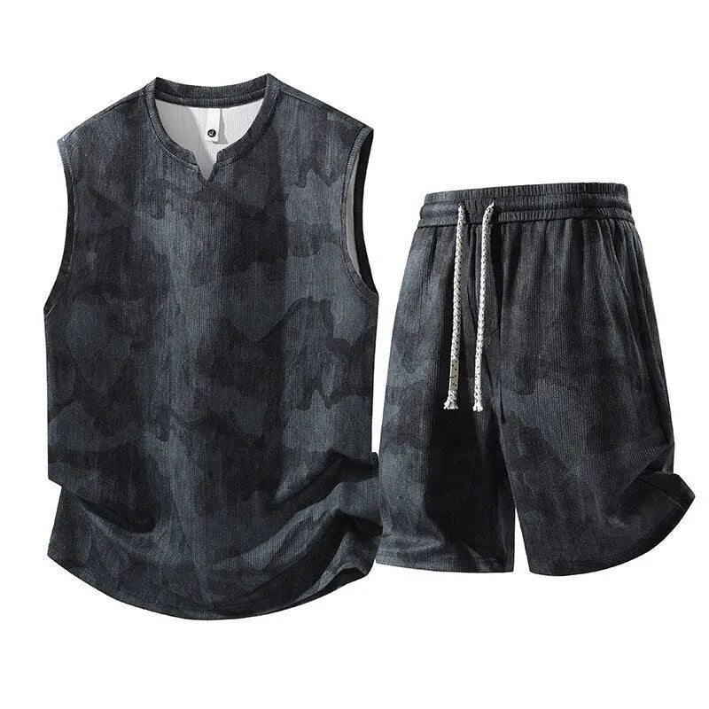 Man's casual sleeveless vest and shorts suit in a quick-drying fabric, shown in light denim blue.