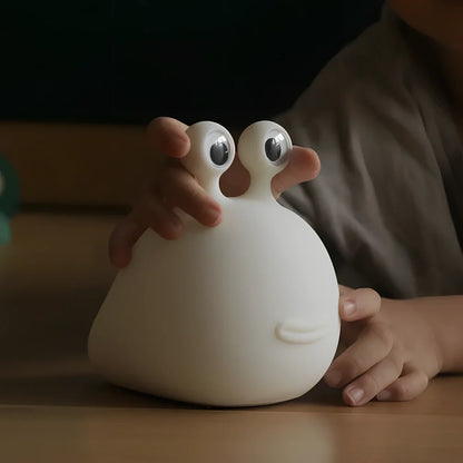 White cartoon slug night light with touch activation and USB power connection