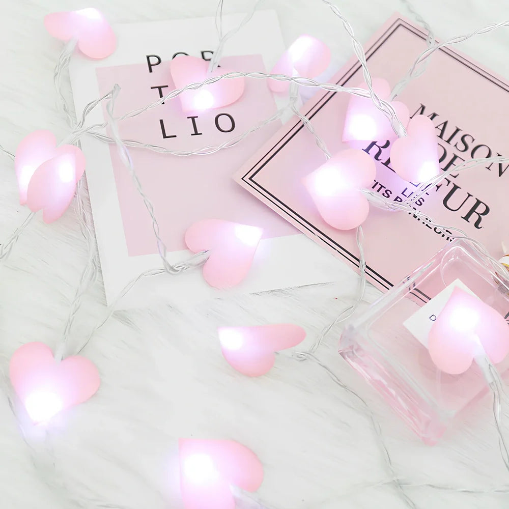 LED string lights with fabric heart elements in pink or blue colour options