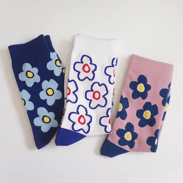 Cozy cotton socks featuring a playful cartoon flower pattern, designed for breathability and comfort.