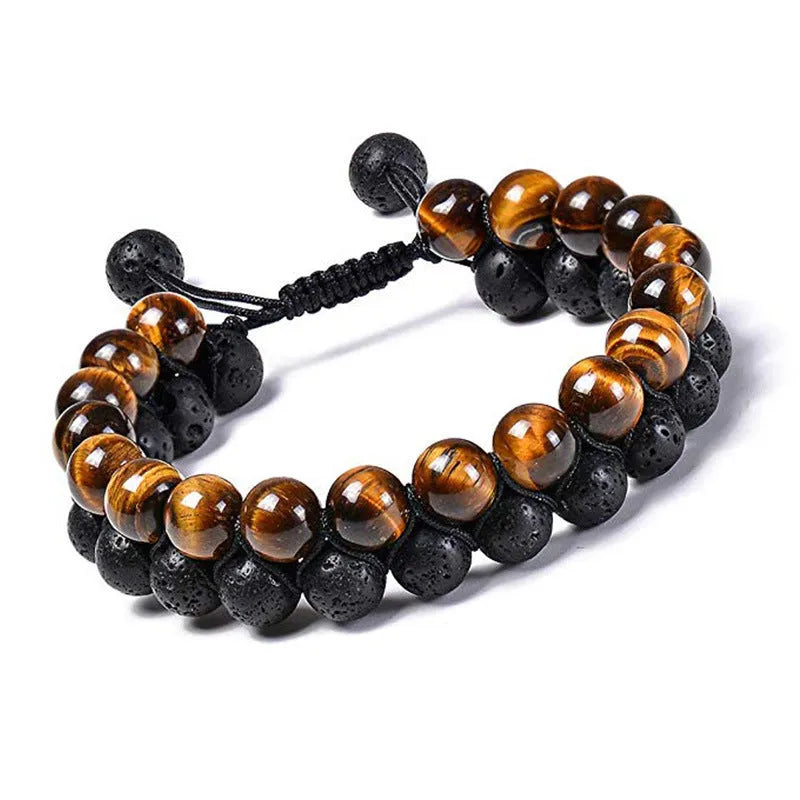Tiger Eye and black agate geometric couple bracelets laid out as a matching set.