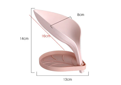 Blue bathroom soap dish with tree texture pattern and drainage channels on white ceramic sink