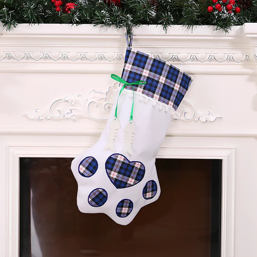 Red dog paw shaped Christmas stocking measuring 20cm by 46cm with reinforced hanging loop