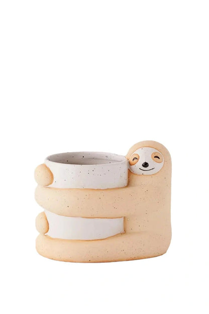 Ceramic sloth flower pot with drainage holes measuring 13.5cm height