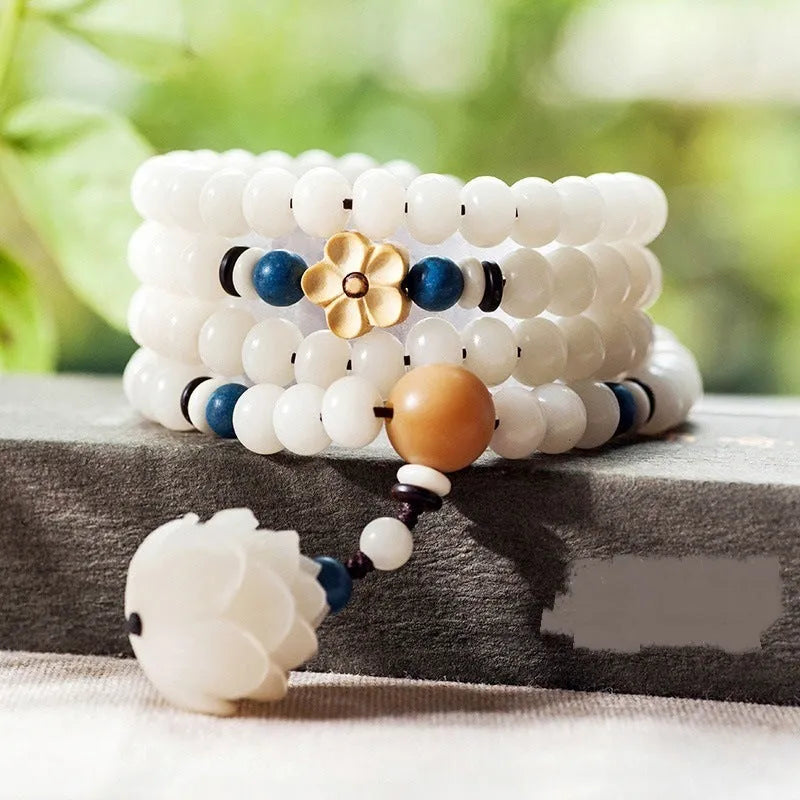 A long white jade Bodhi bead bracelet with 6x8mm beads, shown in various style options including cloisonne and lotus designs.