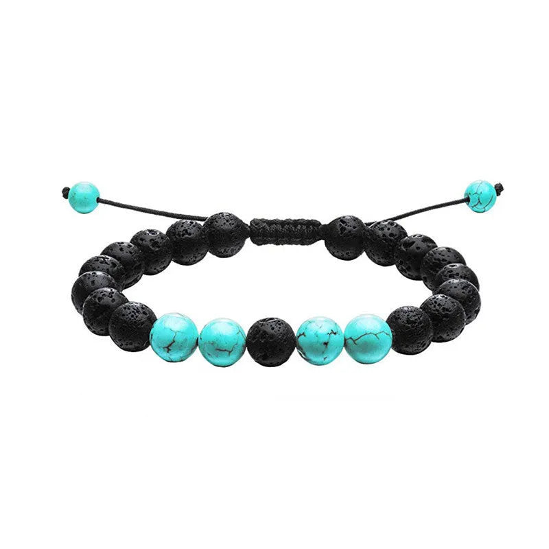 Tiger Eye and black agate geometric couple bracelets laid out as a matching set.
