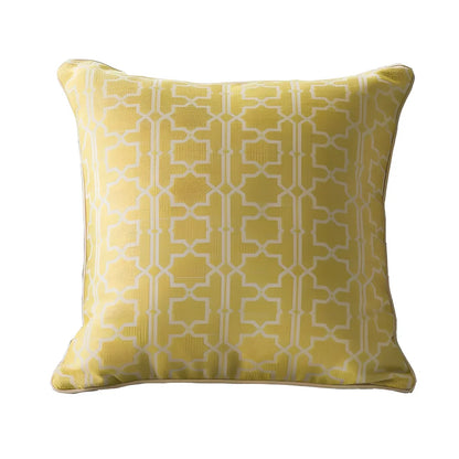 Square beige cushion cover with envelope closure on a grey sofa