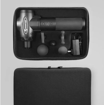 Black and white percussion muscle massager gun with ergonomic handle on a grey background.
