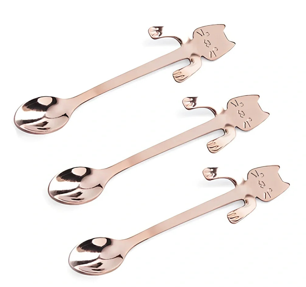 Stainless steel coffee spoon with cartoon cat handle design showing 11.7cm measurement scale