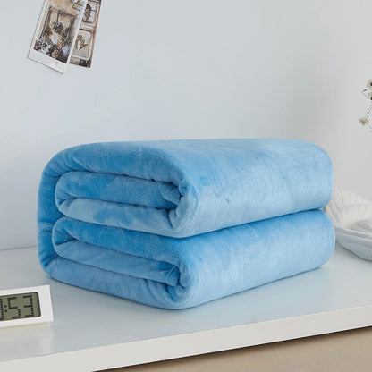 Coral fleece flannel blanket in beige showing textured surface and consistent edges