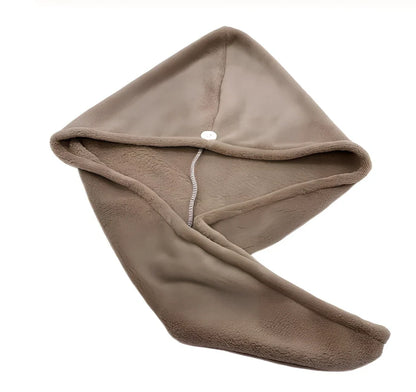 Pink microfiber hair drying towel measuring 25x65cm with button fastening shown wrapped around hair