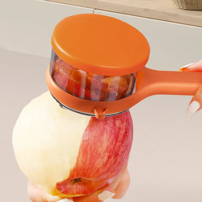 Light green kitchen peeler with an integrated storage bucket for collecting fruit and vegetable peel.