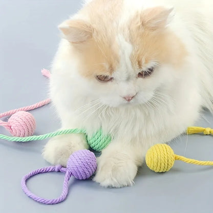 Interactive cat toy ball with bell and rope in green, pink, purple or yellow colours, shown in 3cm and 6cm sizes