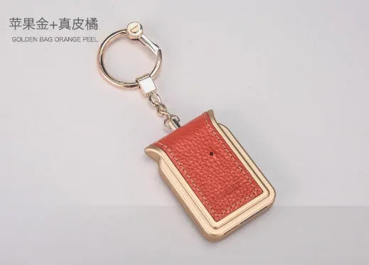 Bluetooth dual SIM adapter keychain in black leather with micro USB charging cable