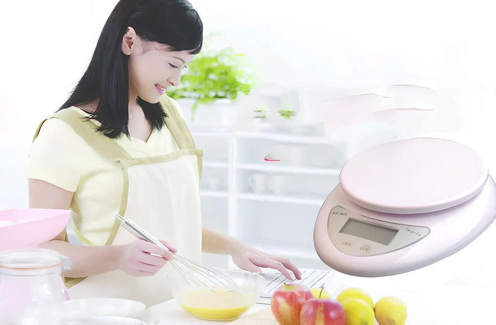 White electronic kitchen scale with digital display showing 1g precision and 5kg capacity measurements
