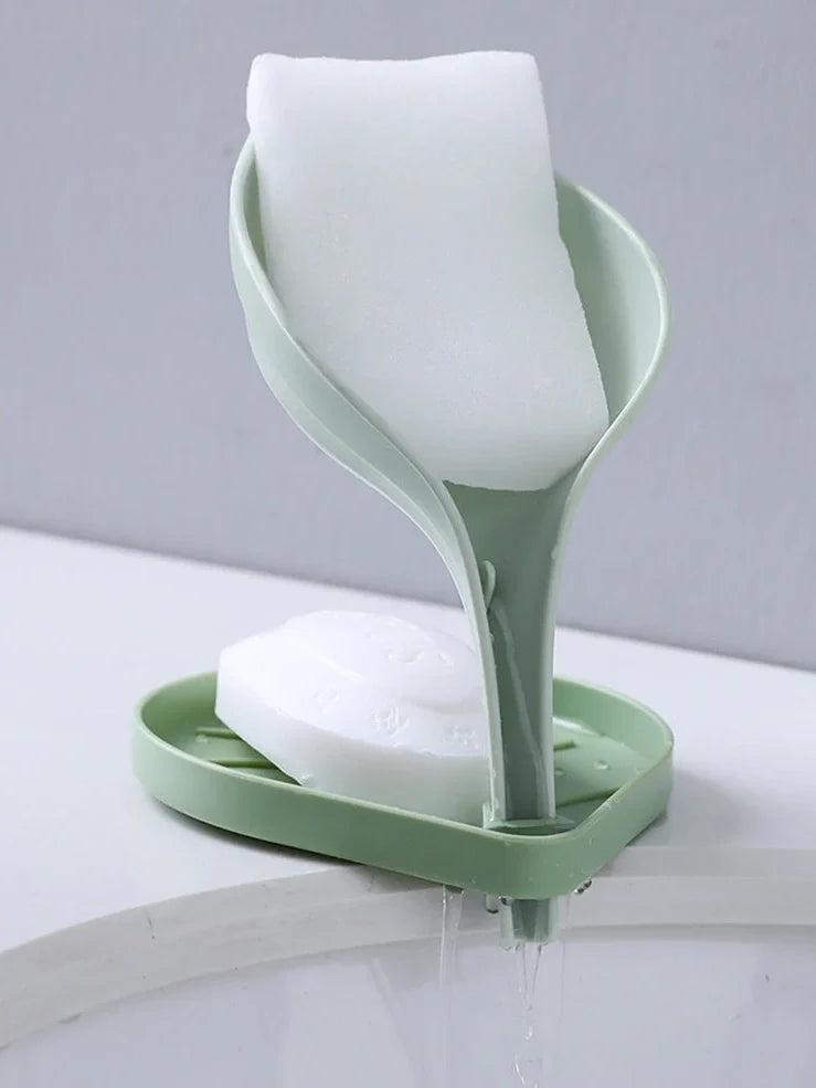 Blue bathroom soap dish with tree texture pattern and drainage channels on white ceramic sink