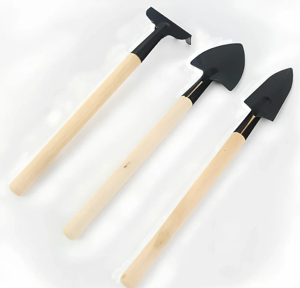 Three-piece gardening tool set showing trowel, hand fork, and weeder with carbon steel blades