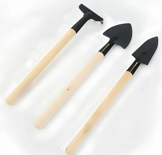 Three-piece gardening tool set showing trowel, hand fork, and weeder with carbon steel blades