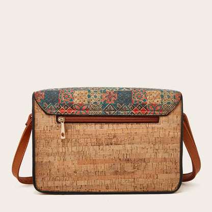 Women's one-shoulder crossbody bag with printed design in green colour, showing large capacity and single strap.
