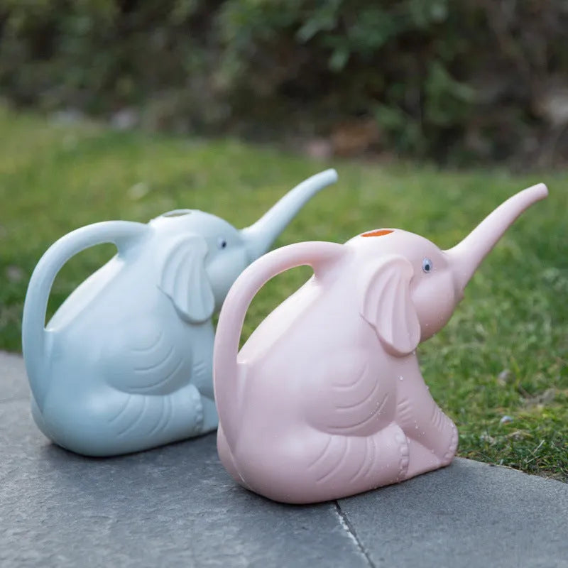 Pink elephant-shaped watering can with long nozzle for children and indoor plants.