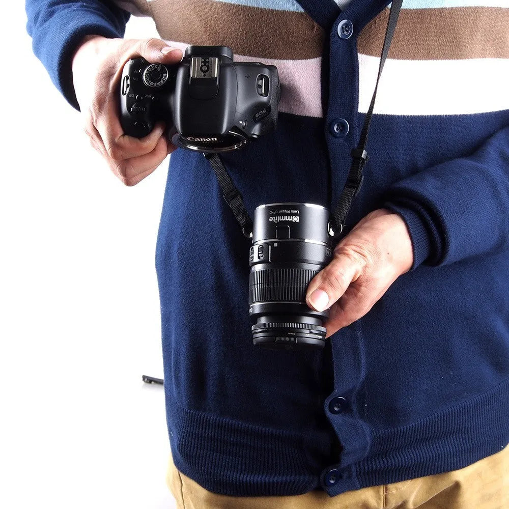 Aluminium alloy Nikon E-Mount lens flipper holding two camera lenses with cotton shoulder strap