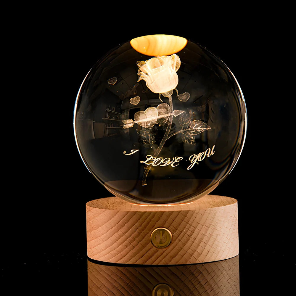 Transparent crystal ball with 3D laser inner carving of galaxy patterns on charging base