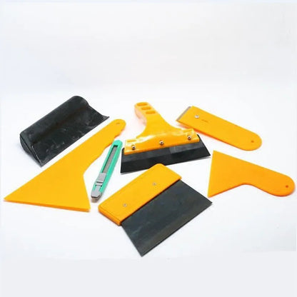 Seven-piece car foil tool set with scrapers, knives, and pressing block for film application