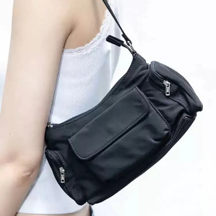 Leather women's shoulder bag with double pockets and side line detailing, made from black PU material with nylon cloth lining, measuring 24cm long, 9cm wide and 14cm high as a lightweight unisex style accessory for casual or professional use.