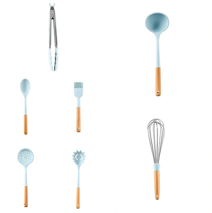 Blue silicone non-stick cookware set with frying spatula, colander, egg beater, and white iron storage bucket for kitchen organisation