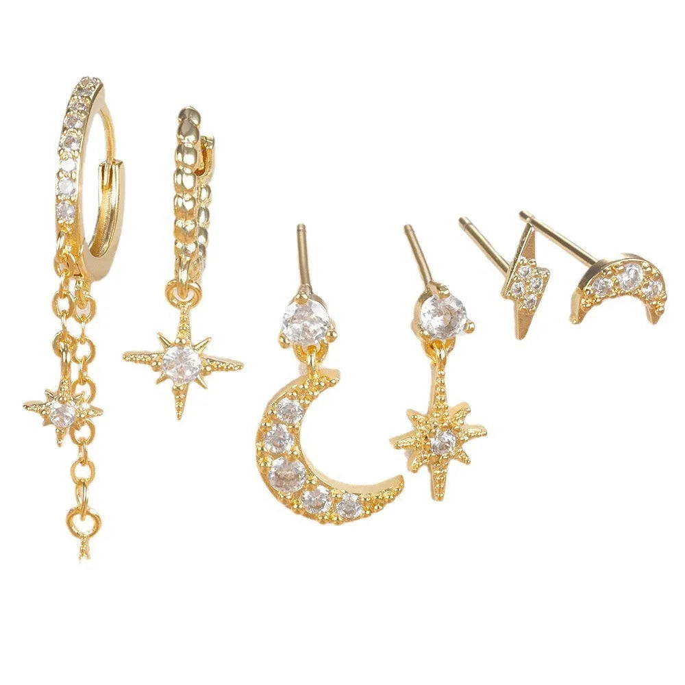 XINGX gold chain tassel earrings set showing six zircon stud earrings with dangling chain elements