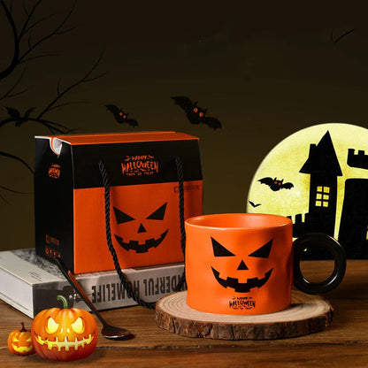 Ceramic pumpkin-shaped mugs in orange and white colors, featuring a sturdy handle and festive holiday design