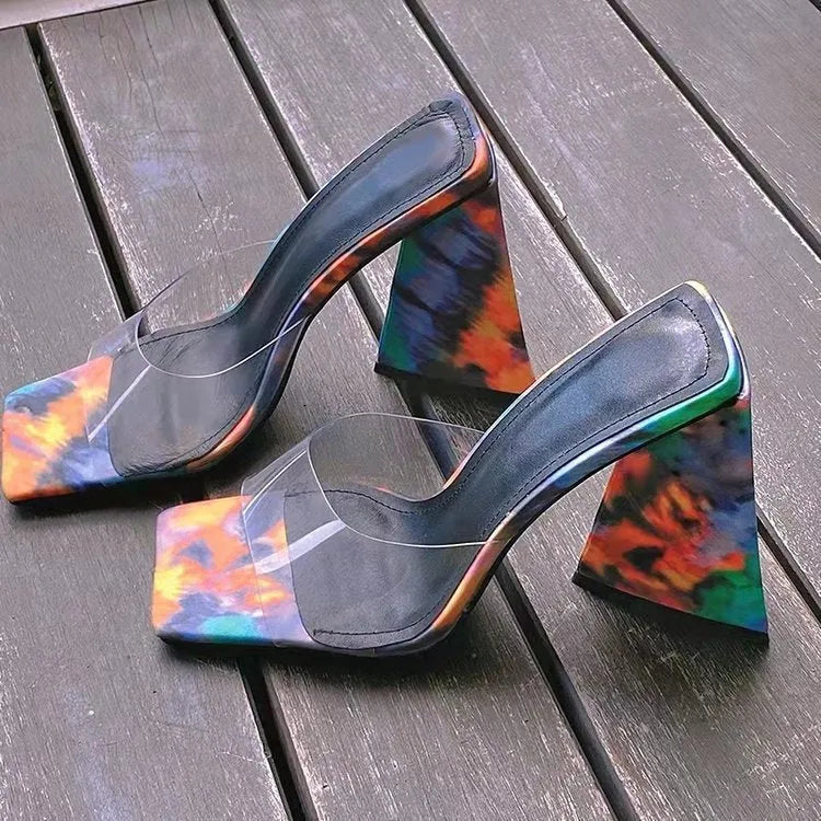 Women's solid colour square toe slippers with a thick triangular heel, shown in black.