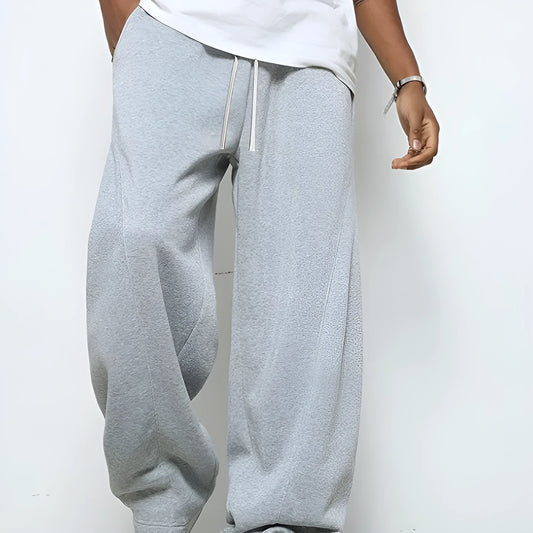 Men's solid colour casual trousers with a straight leg and elastic drawstring waist.