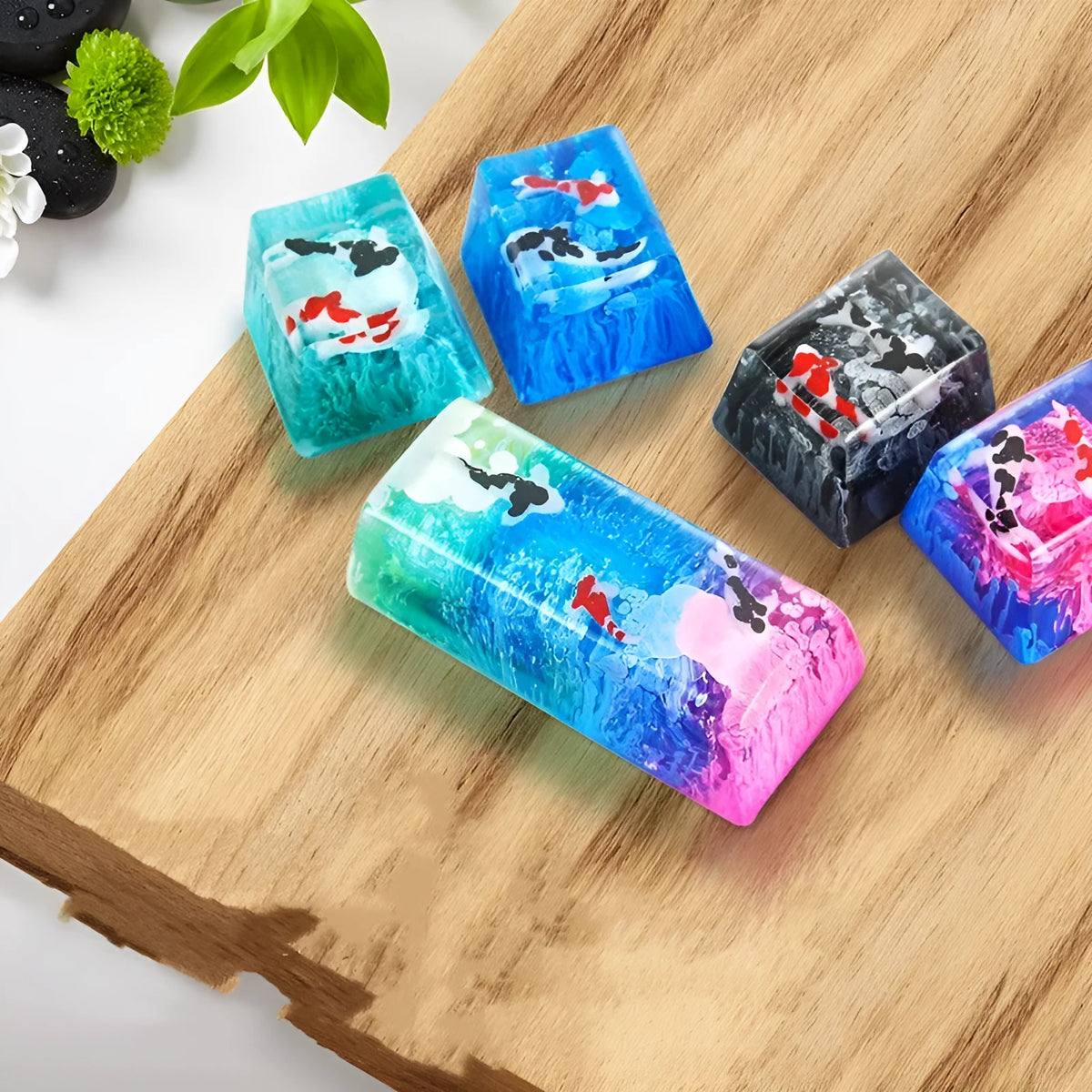 Close-up of a custom resin keycap featuring a detailed blue and orange koi fish scene, designed for Cherry MX mechanical keyboards.