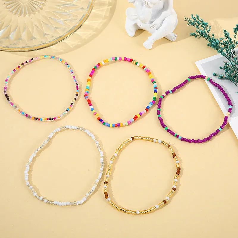 Handmade bohemian beaded bracelet set with 17 mixed material pieces in Set colour
