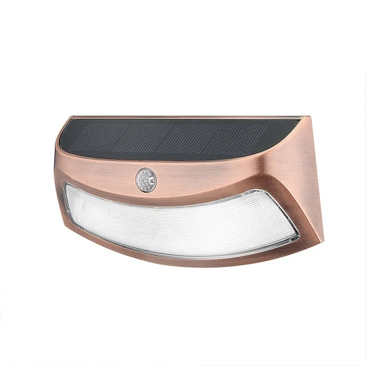 Solar outdoor wall lamp with smiling face design measuring 153mm × 76mm × 38mm for garden lighting
