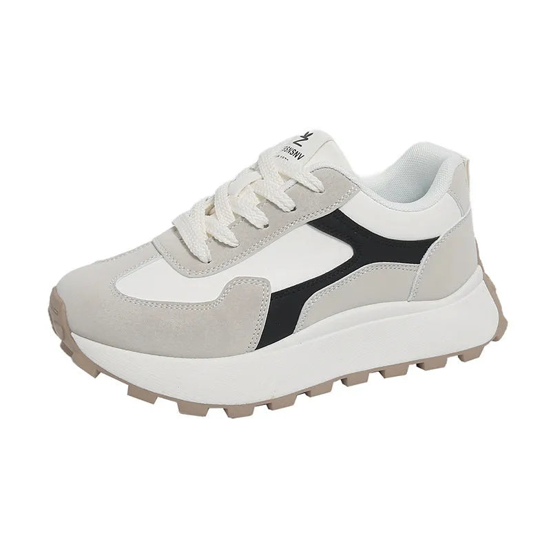 Women's solid colour low-top sports shoes with flat platform sole and lace-up front.