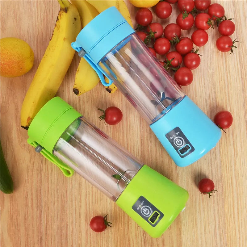 Pink portable USB electric fruit juicer blender cup with stainless steel blade and carry handle.