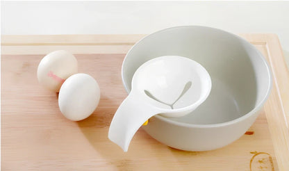White ABS plastic egg separator with 10cm handle and 7.3cm bowl for yolk separation