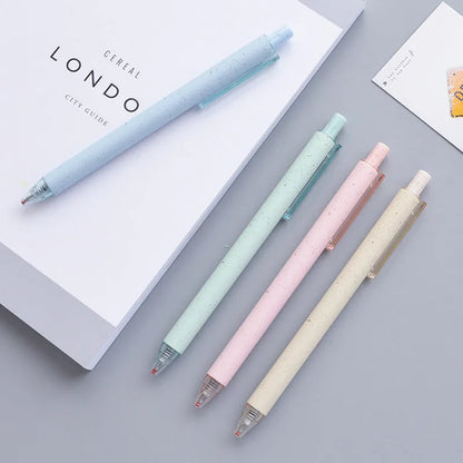 Set of 12 coloured 0.5mm gel pens with black ink and press-button tops on a white surface.