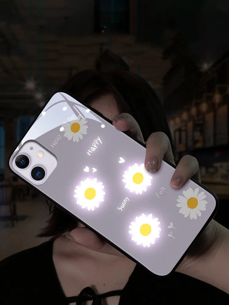 Luminous phone case with voice-activated colour lights showing painted daisy design on Apple iPhone