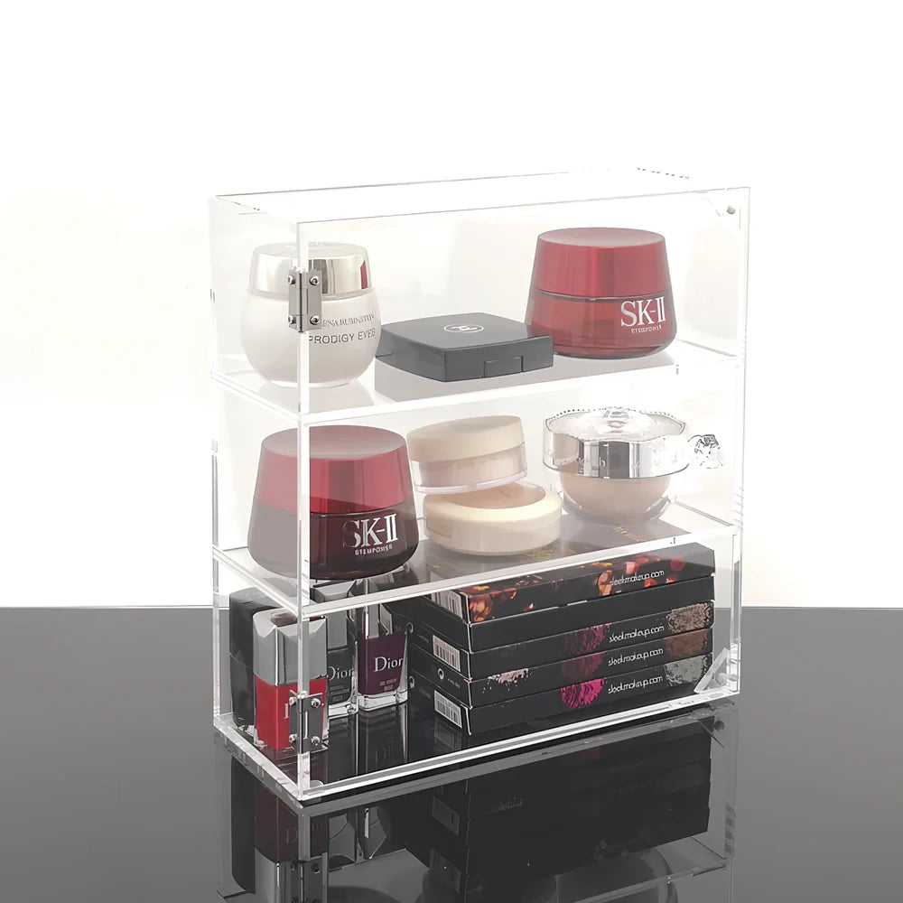 Clear acrylic cosmetic storage box measuring 24x10x34cm with transparent sides showing makeup organisation