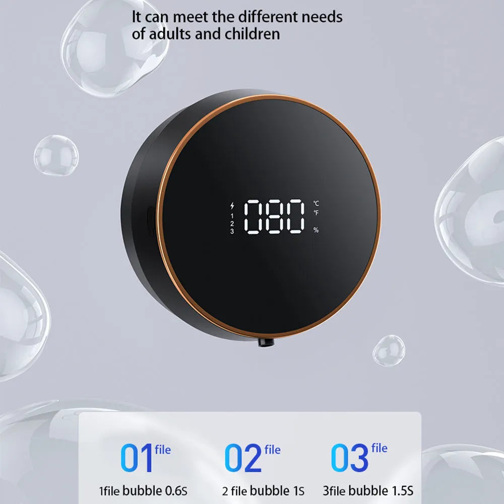 Black smart auto sensing foam dispenser mounted on a wall with USB charging cable, showing infrared sensor and foam output