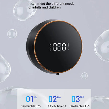 Black smart auto sensing foam dispenser mounted on a wall with USB charging cable, showing infrared sensor and foam output