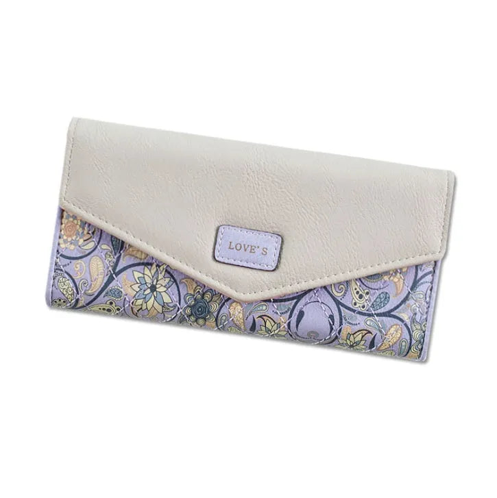 Three-fold leather wallet with buckle closure showing black colour variant, note clip visible inside compartment
