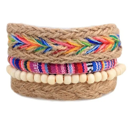 Hand-woven brown leather bracelet with wooden beads and rope detailing on a wrist.