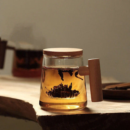 Premium glass tea infuser cup with wooden handle, offering a unique tea-water separation system and temperature-resistant construction for a refined tea experience.