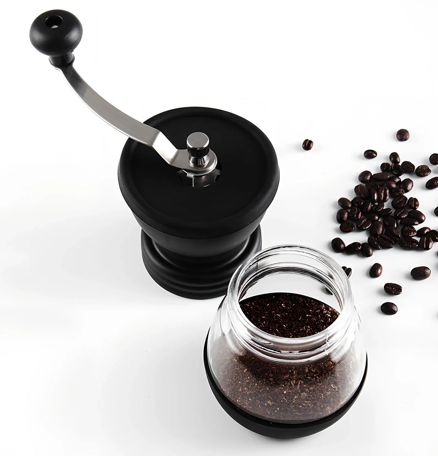 Manual coffee grinder with beech wood body and stainless steel grinding mechanism on kitchen counter