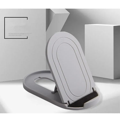 Black adjustable lazy bracket phone stand holding a mobile device at an angle on a wooden table.